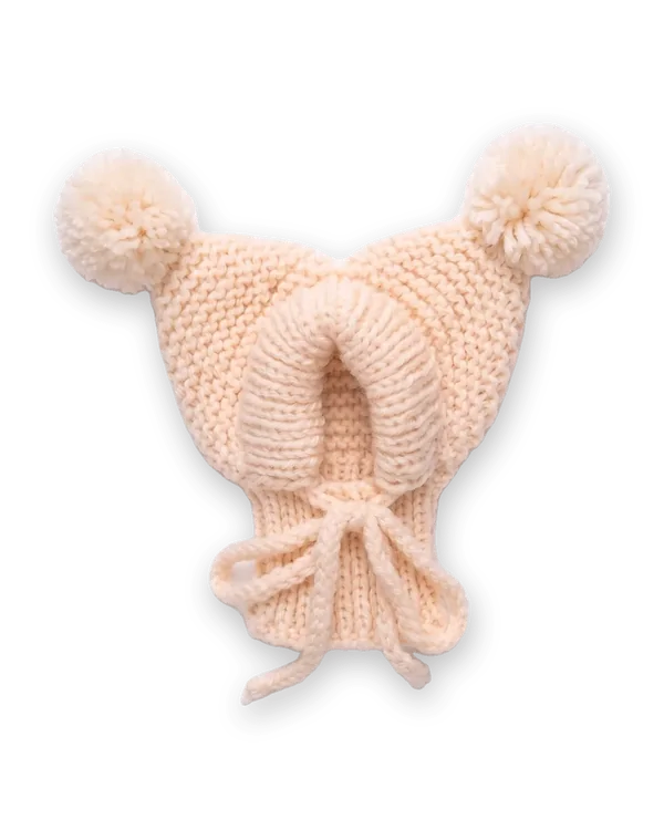 Beige knitted dog hood with two pom-poms