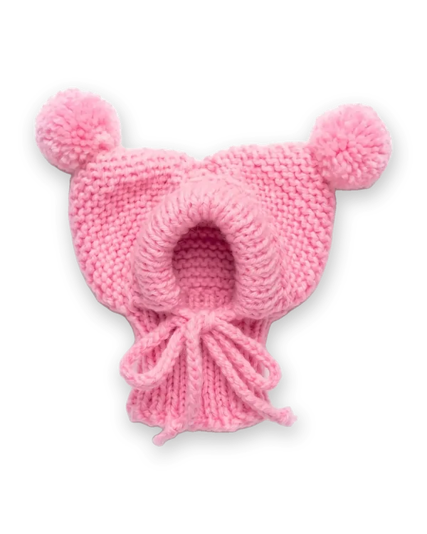 Pink knitted dog hood with two pom-poms